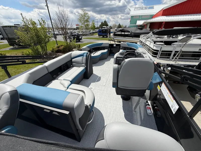 Slide: The Image of Interior view of 2026 South Bay S224FCR pontoon boat with gray and blue seating. - 18