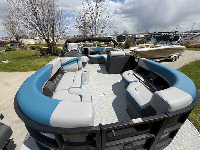 Slide: The Image of 2026 South Bay S224FCR pontoon boat with blue and gray seating. - 8