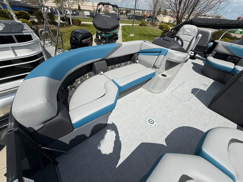Slide: The Image of Interior of 2026 South Bay S224FCR pontoon boat with blue and gray seating. - 9