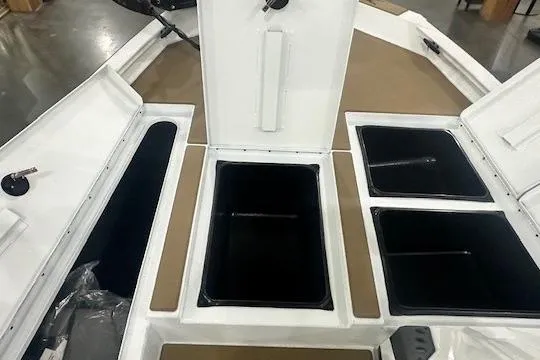 Slide: The Image of 2026 Xpress H18 boat storage compartments with open lids, showcasing interior space. - 10