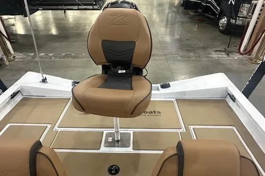 Slide: The Image of 2026 Xpress H18 boat interior with tan seating and modern design. - 11