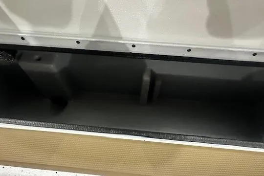 Slide: The Image of Interior compartment of 2026 Xpress H18 boat, showcasing storage space and design. - 7