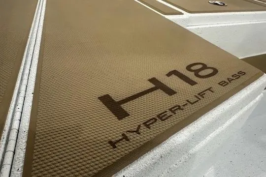 Slide: The Image of 2026 Xpress H18 Hyper-Lift Bass boat deck with textured surface. - 9