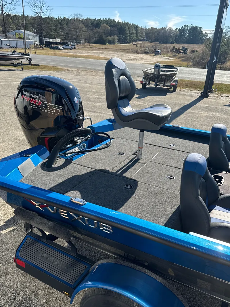 Slide: The Image of Vexus AVX1880 2025 boat with Mercury engine on parking lot. - 12