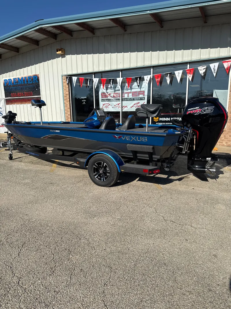 Slide: The Image of 2025 Vexus AVX1880 boat parked outside a store. - 28