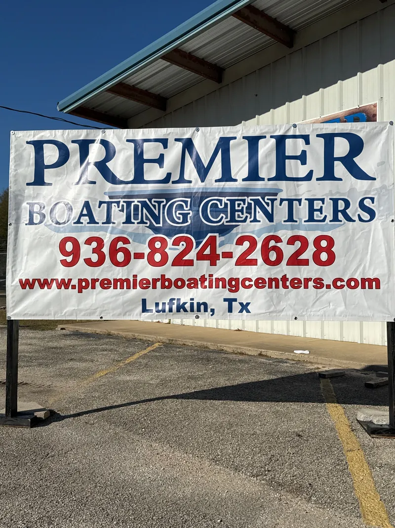 Slide: The Image of Premier Boating Centers banner in Lufkin, Texas, with contact details. - 29