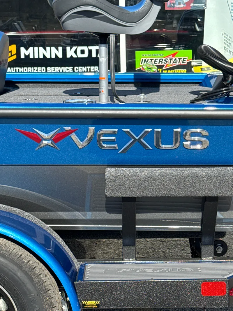 Slide: The Image of Vexus AVX1880 boat 2025, blue, with Minn Kota and Interstate logos. - 3