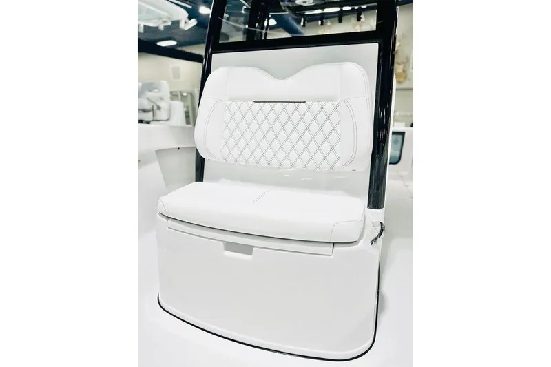Slide: The Image of 2026 Sportsman Open 262 Center Console boat seat with diamond-stitched white upholstery. - 10