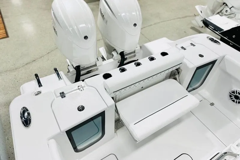 Slide: The Image of 2026 Sportsman Open 262 Center Console boat with dual engines and sleek white design. - 12