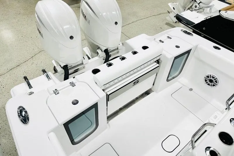Slide: The Image of 2026 Sportsman Open 262 Center Console boat with dual engines and sleek design. - 13