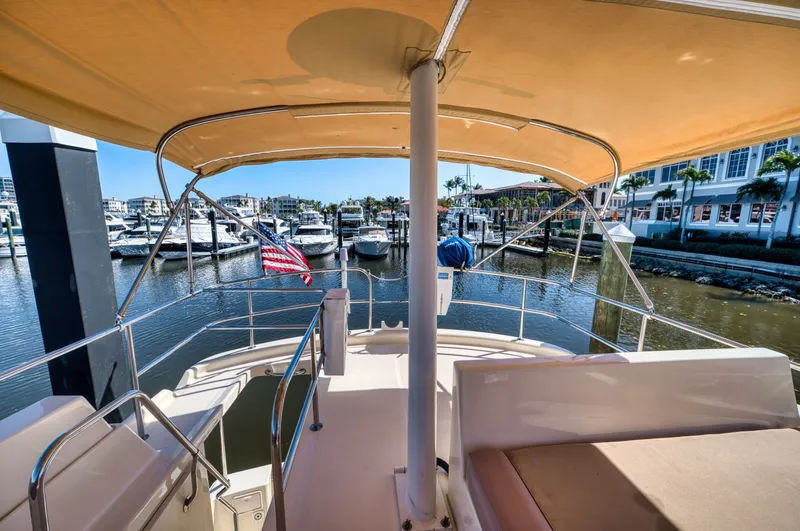Slide: The Image of 2006 Mainship 34 Trawler docked with sunshade. - 12