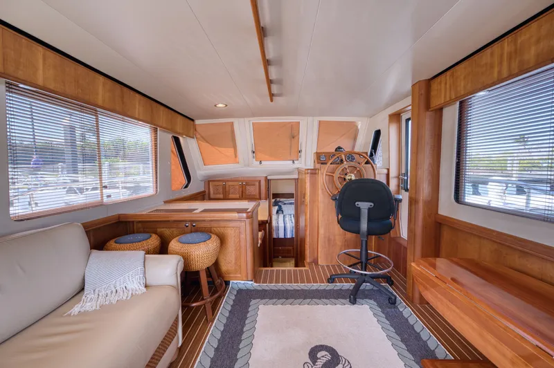 Slide: The Image of Interior of a 2006 Mainship 34 Trawler with wooden decor. - 21
