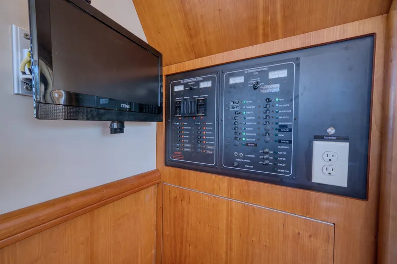 Slide: The Image of Electrical panel and TV on Mainship 34 Trawler 2006. - 24