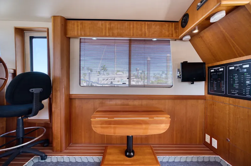 Slide: The Image of Interior of a 2006 Mainship 34 Trawler with wood finish. - 26