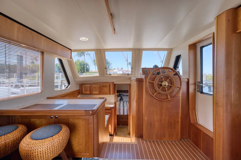 Slide: The Image of Interior of a 2006 Mainship 34 Trawler with wooden finish. - 28