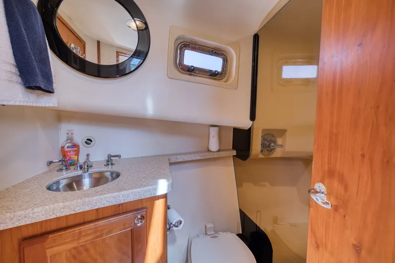 Slide: The Image of Bathroom in 2006 Mainship 34 Trawler with sink and toilet. - 34