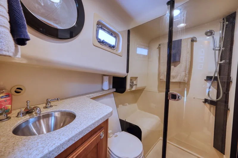 Slide: The Image of Bathroom in 2006 Mainship 34 Trawler with shower and sink. - 35