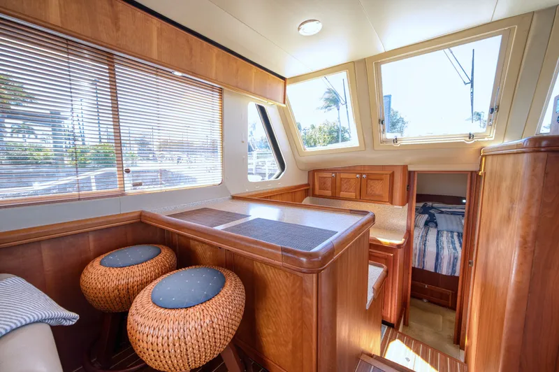 Slide: The Image of Interior of a 2006 Mainship 34 Trawler with wooden furnishings. - 38