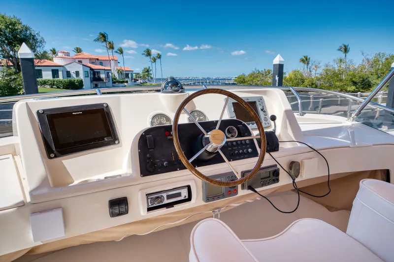 Slide: The Image of Mainship 34 Trawler 2006 helm with waterfront view. - 39