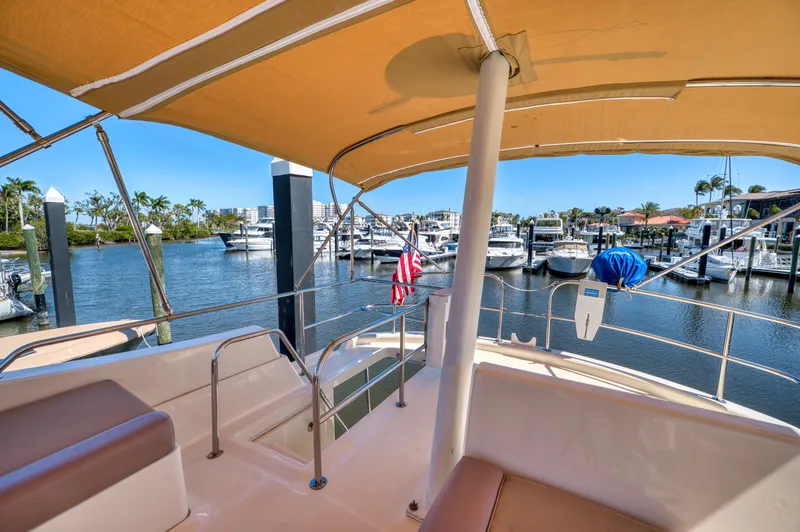 Slide: The Image of 2006 Mainship 34 Trawler in sunny marina setting. - 41