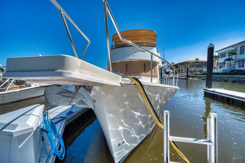 Slide: The Image of 2006 Mainship 34 Trawler docked on a sunny day. - 5