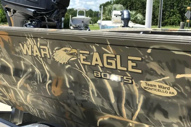 Slide: The Image of War Eagle 754LDV 2026 boat with camouflage design and logo, Monticello AR. - 4
