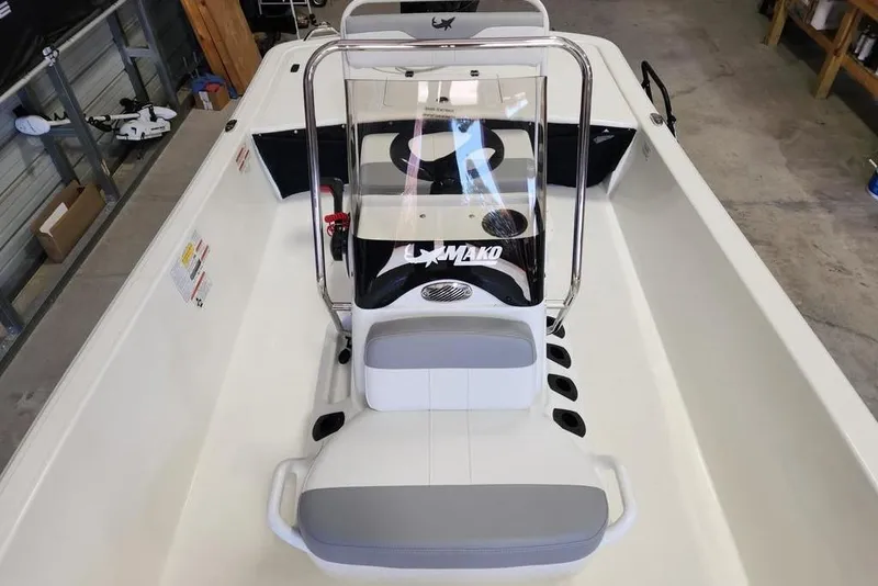 Slide: The Image of 2026 Mako Pro Skiff 17 CC boat interior with console and seating. - 6