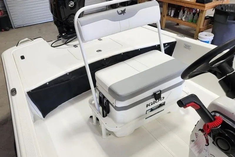 Slide: The Image of 2026 Mako Pro Skiff 17 CC boat interior with Igloo cooler seat. - 8