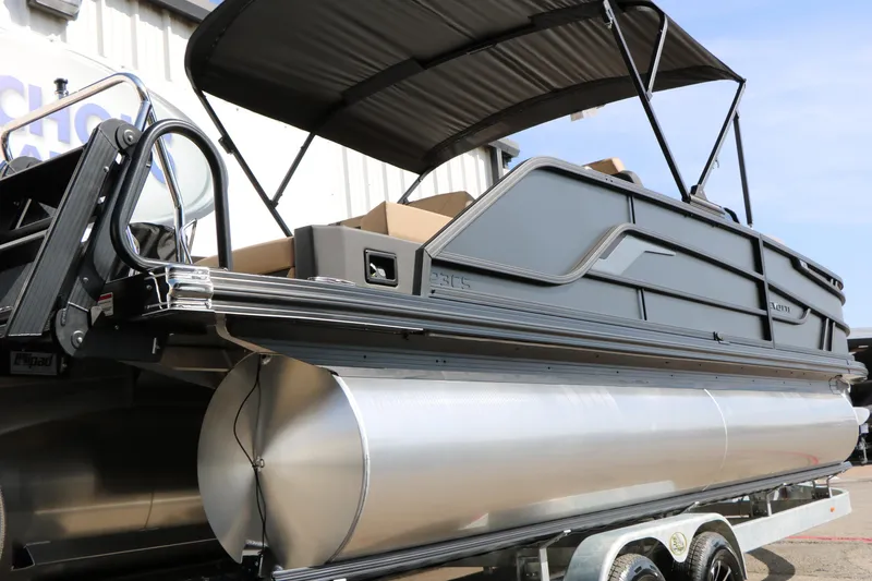 Slide: The Image of 2026 Evotti 723CS pontoon boat with sleek design and canopy, displayed on a trailer. - 11