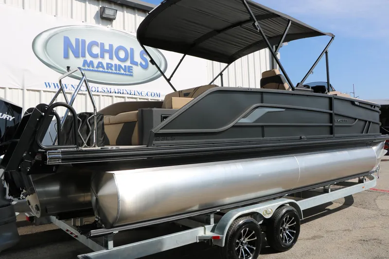 Slide: The Image of 2026 Evotti 723CS pontoon boat on trailer at Nichols Marine dealership. - 12
