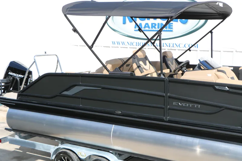 Slide: The Image of 2026 Evotti 723CS pontoon boat with canopy and Mercury engine at dealership. - 15