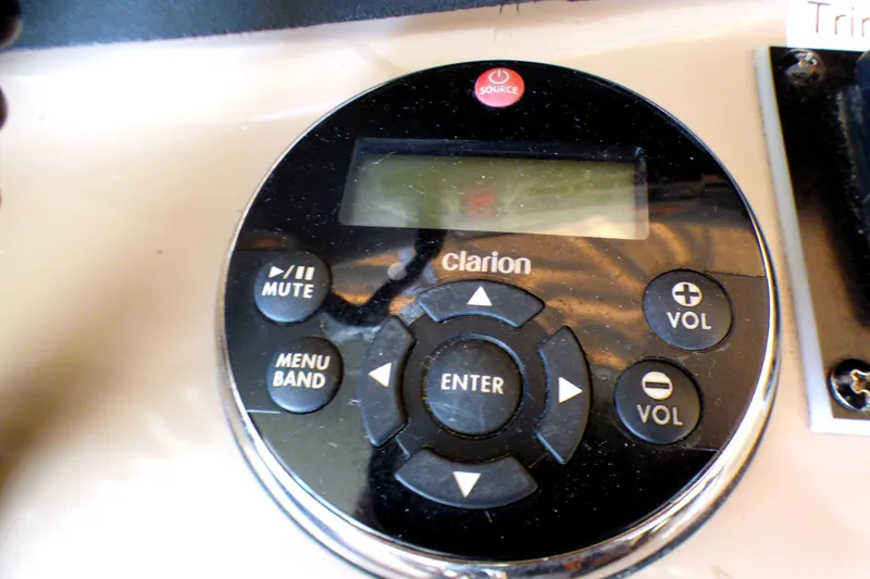 Slide: The Image of Clarion audio control panel on 2002 Sea Ray 340 Amberjack boat dashboard. - 22