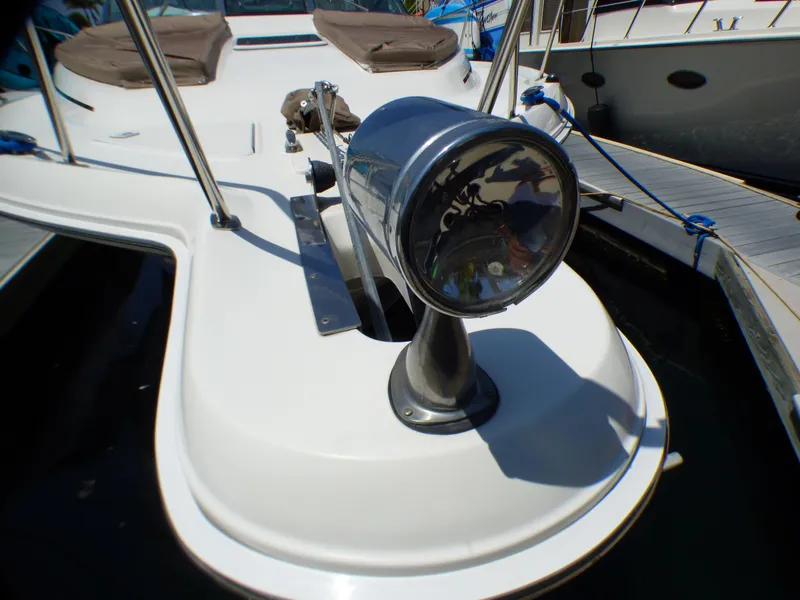 Slide: The Image of Close-up of a 2002 Sea Ray 340 Amberjack boat spotlight. - 25