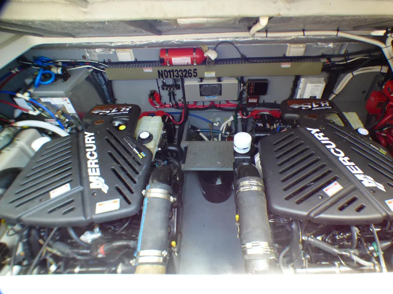 Slide: The Image of Engine room of 2002 Sea Ray 340 Amberjack with Mercury engines. - 26