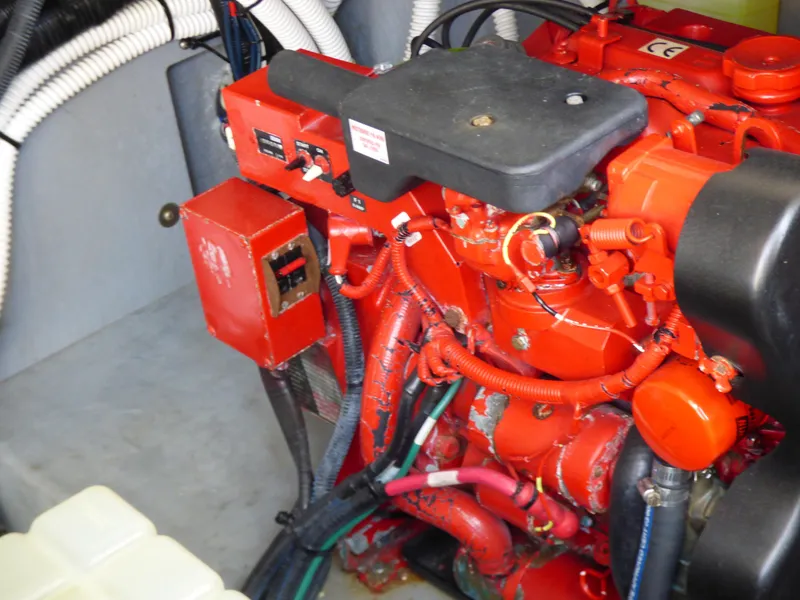 Slide: The Image of Engine compartment of 2002 Sea Ray 340 Amberjack, red engine. - 29