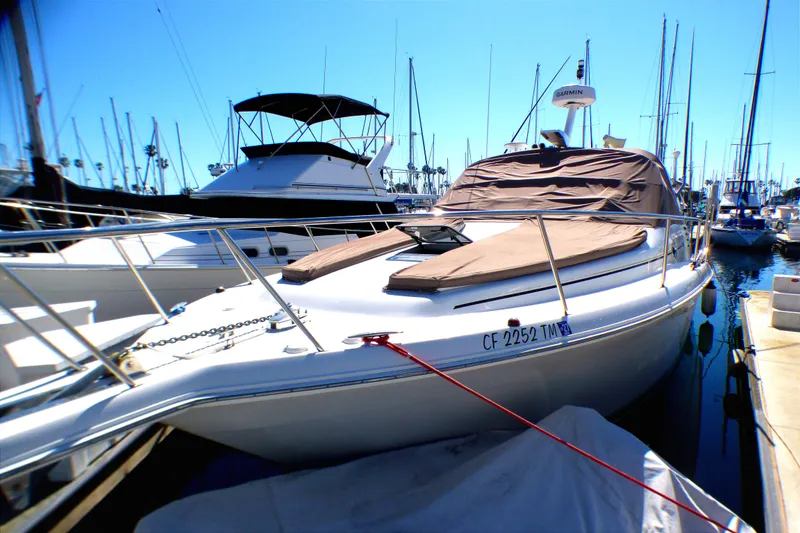 Slide: The Image of 2002 Sea Ray 340 Amberjack docked at marina, covered and ready for sailing. - 31
