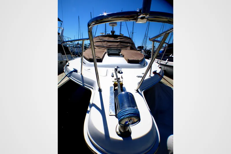 Slide: The Image of 2002 Sea Ray 340 Amberjack boat deck with railing and covered seating area. - 32