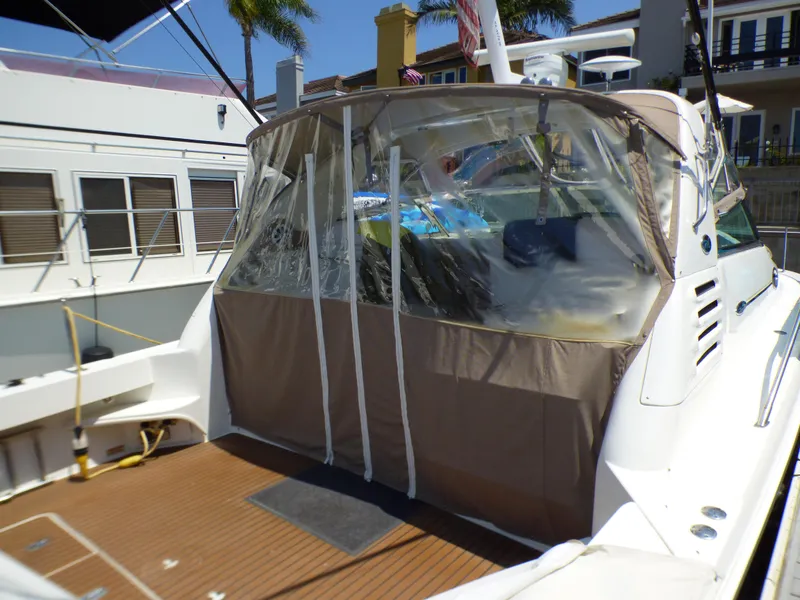 Slide: The Image of 2002 Sea Ray 340 Amberjack with canopy in harbor. - 4
