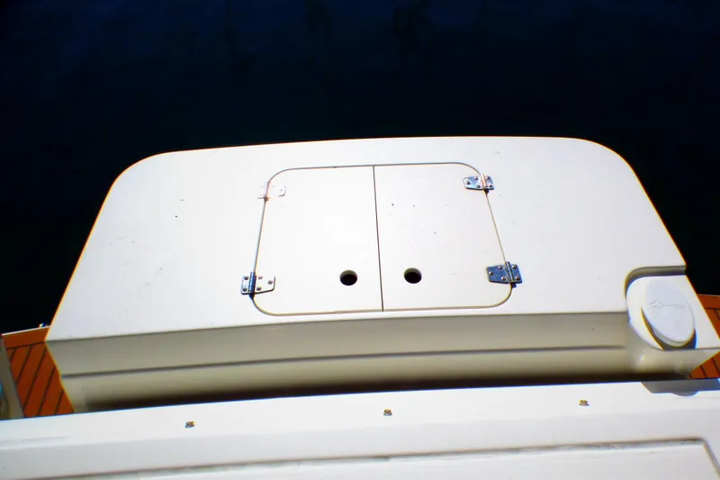 Slide: The Image of 2002 Sea Ray 340 Amberjack boat deck with storage compartment. - 43
