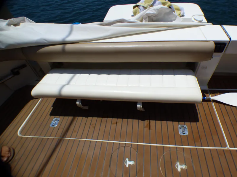 Slide: The Image of Sea Ray 340 Amberjack 2002 seating area on teak deck. - 5