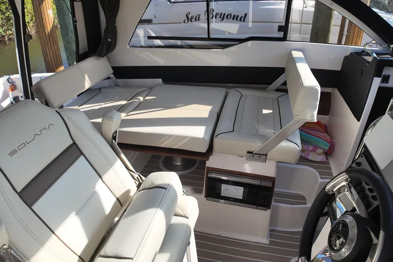 Slide: The Image of Interior of 2026 Solara S-250 Coupe boat with luxurious seating and modern design. - 14