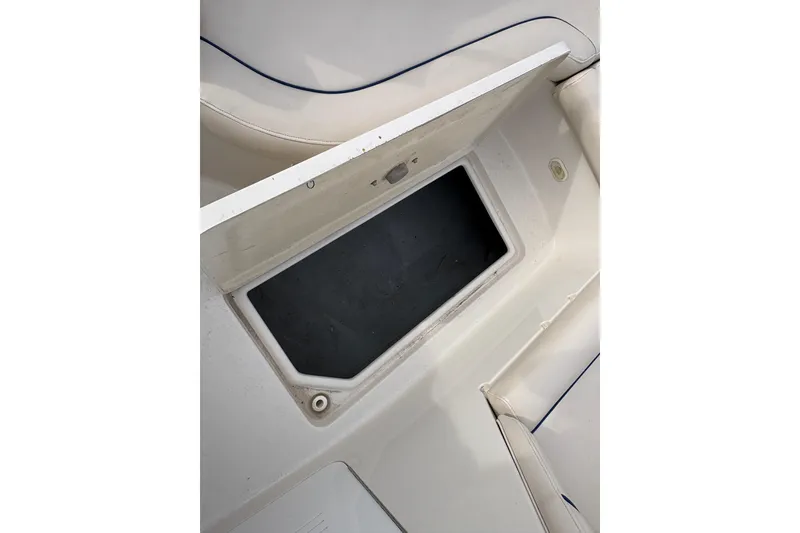 Slide: The Image of Open storage compartment on 2002 Monterey 240 Explorer Sport boat. - 15