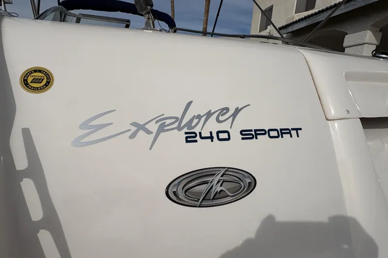 Slide: The Image of 2002 Monterey 240 Explorer Sport boat logo and certification badge. - 5
