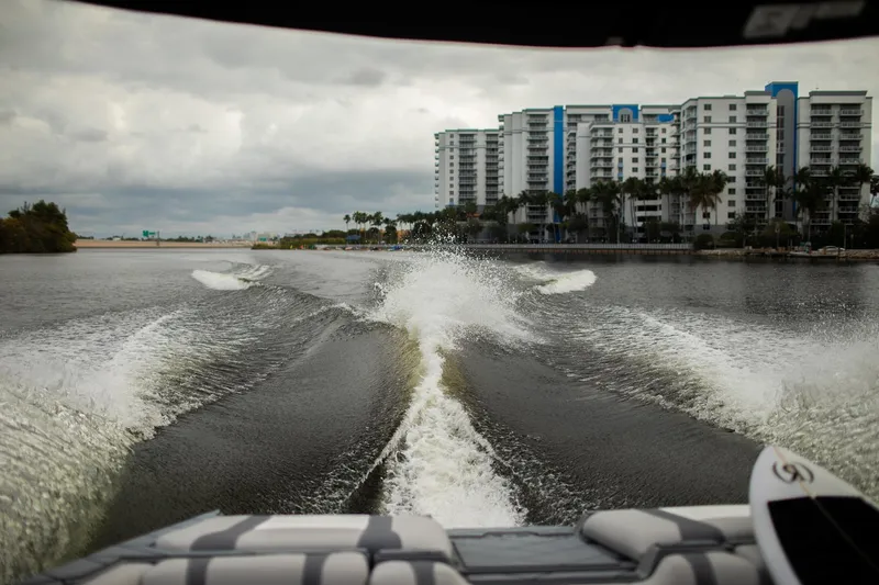 Slide: The Image of Wake created by 2026 Malibu Wakesetter 23 LSV, with cityscape in the background. - 19