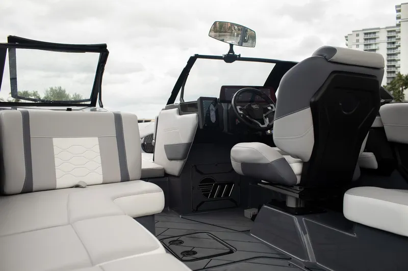 Slide: The Image of 2026 Malibu Wakesetter 23 LSV interior with modern seating and dashboard design. - 7