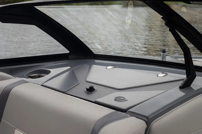 Slide: The Image of 2026 Malibu Wakesetter 23 LSV interior detail with cup holder and sleek design. - 9