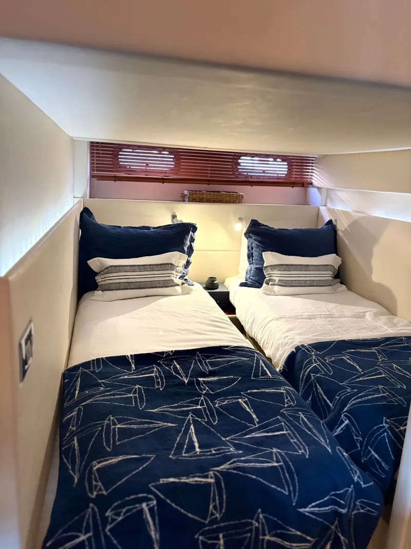 Slide: The Image of Interior of 2010 Sea Ray 470 Sundancer with twin beds. - 11