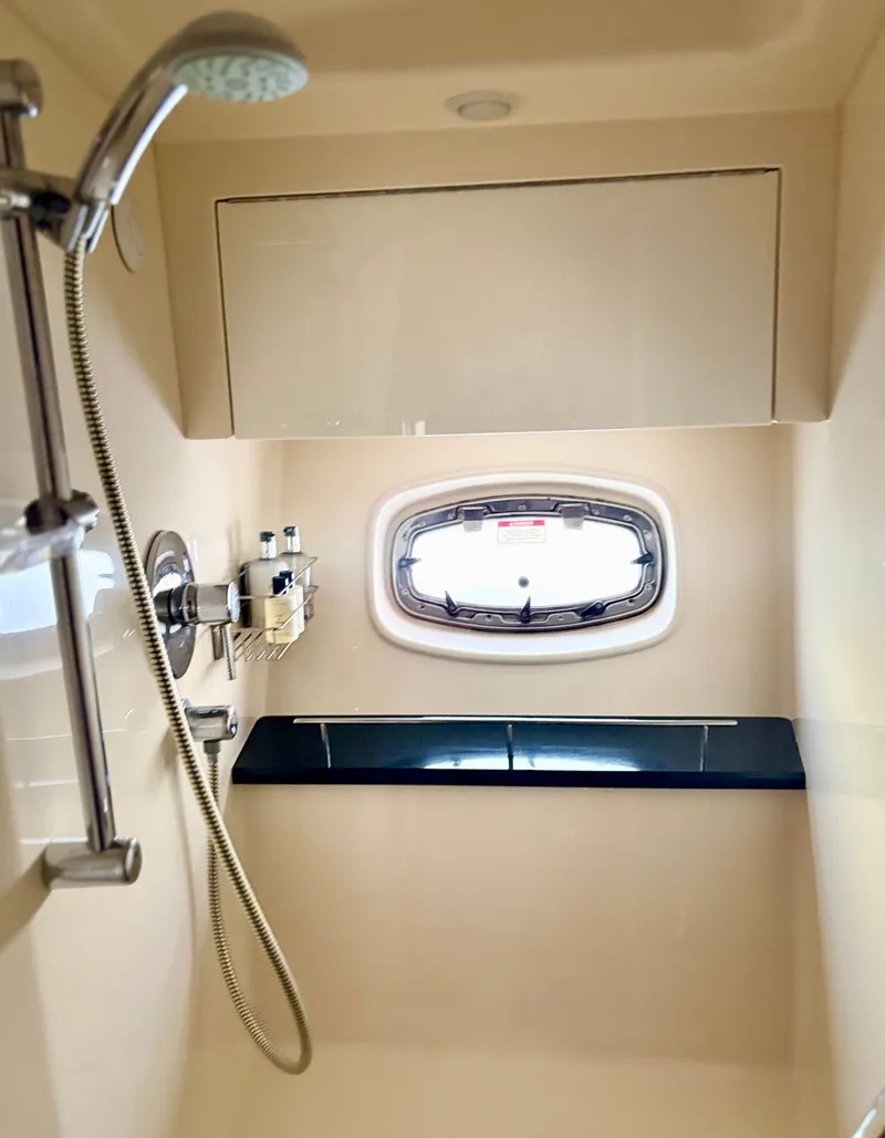 Slide: The Image of Sea Ray 470 Sundancer 2010 bathroom with shower and window. - 13
