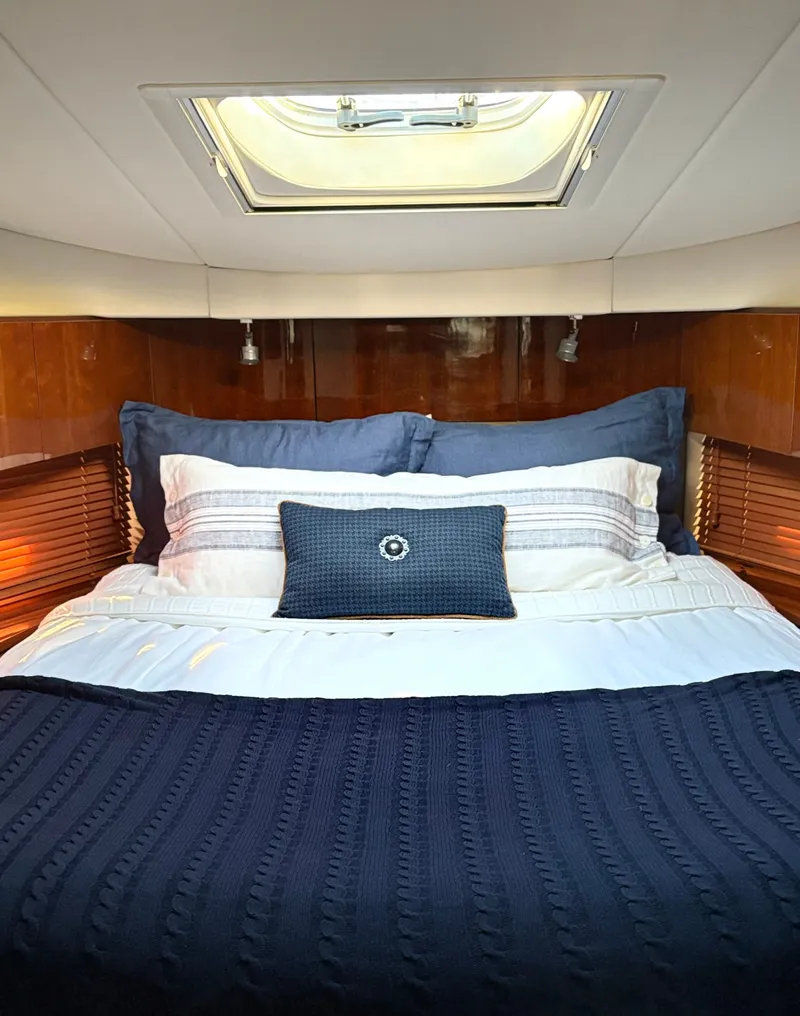 Slide: The Image of Luxurious bedroom on a 2010 Sea Ray 470 Sundancer yacht. - 14