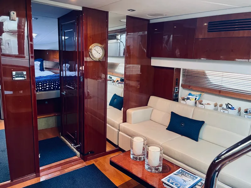 Slide: The Image of Interior of a 2010 Sea Ray 470 Sundancer yacht with elegant seating area. - 6
